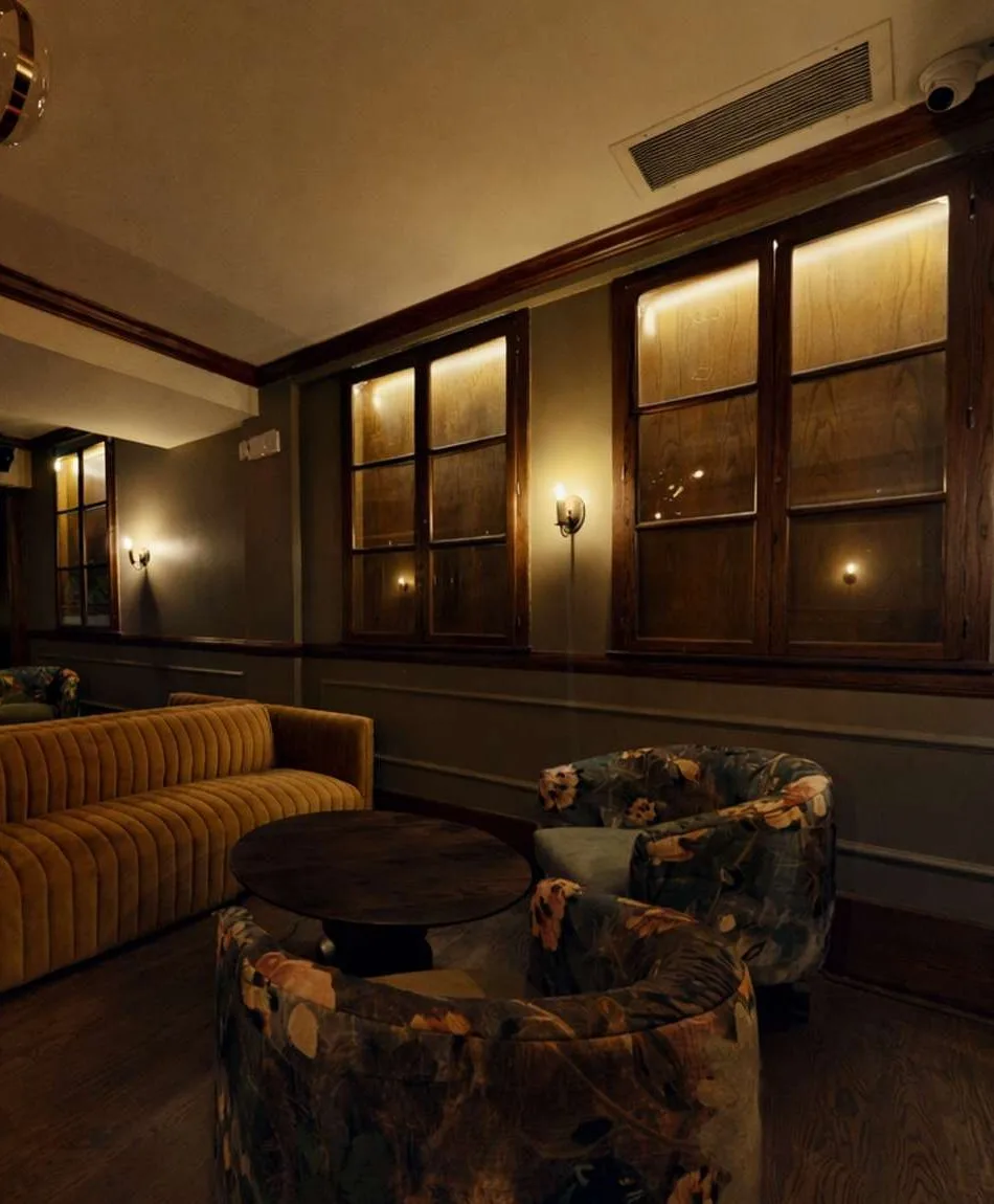 Lounge seating area with sofa and armchairs at The Gingerman
